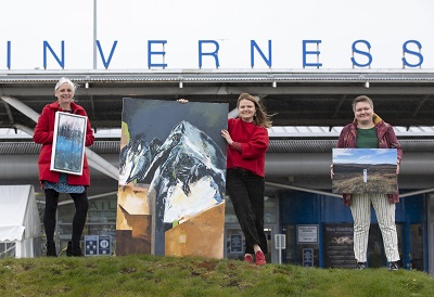 UHI Graduates showing their work in front of Inverness Airport